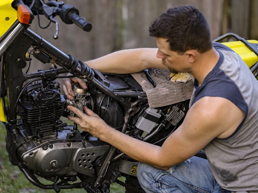 a man fixing a car engine