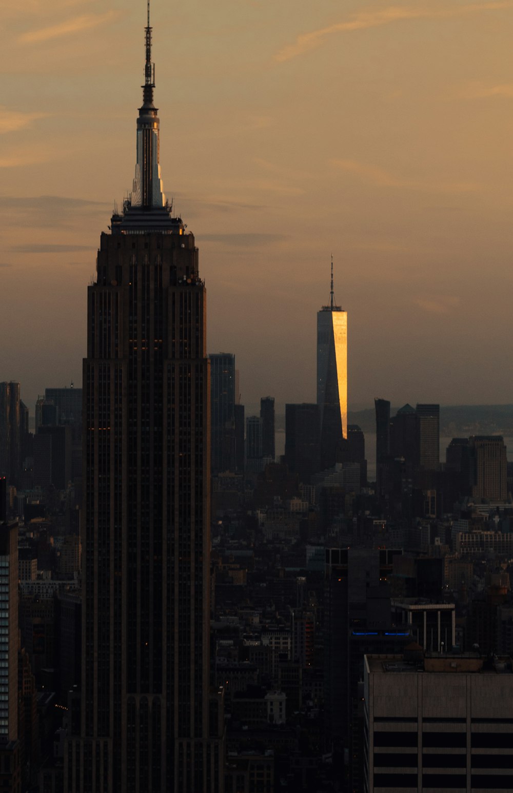 a couple of tall buildings in a city