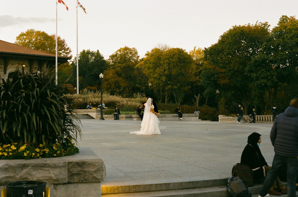 a bride and groom in a park