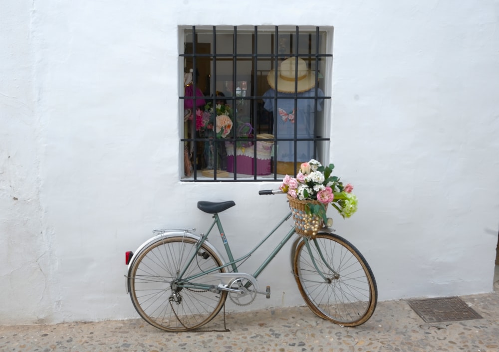 a bicycle with flowers in a basket