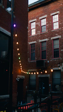 Residents enjoying a summer barbecue in the courtyard of a Boston condo managed by Beacon.
