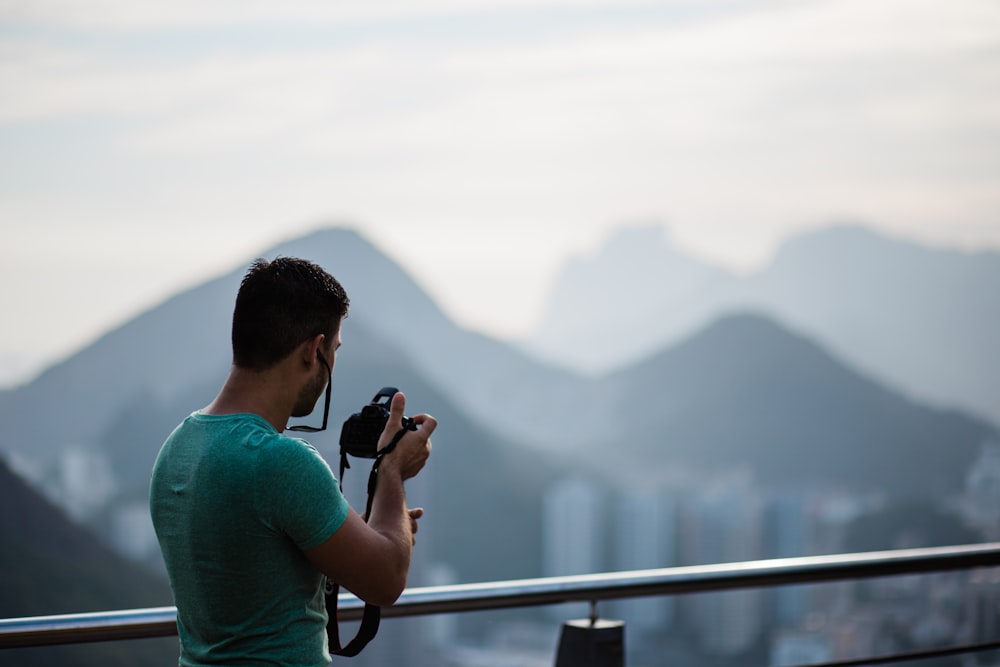 a person taking a picture of a city
