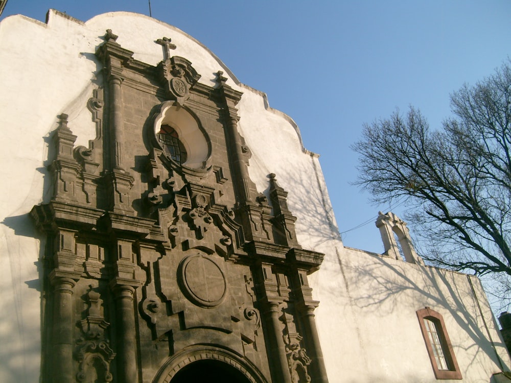 a building with statues on the side