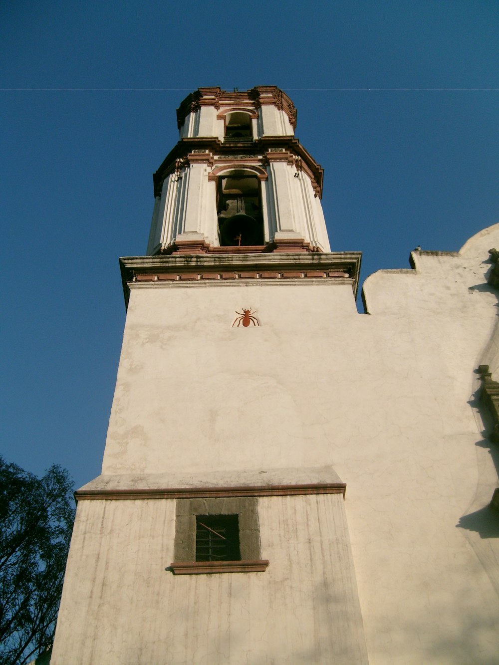 a white building with a bell tower