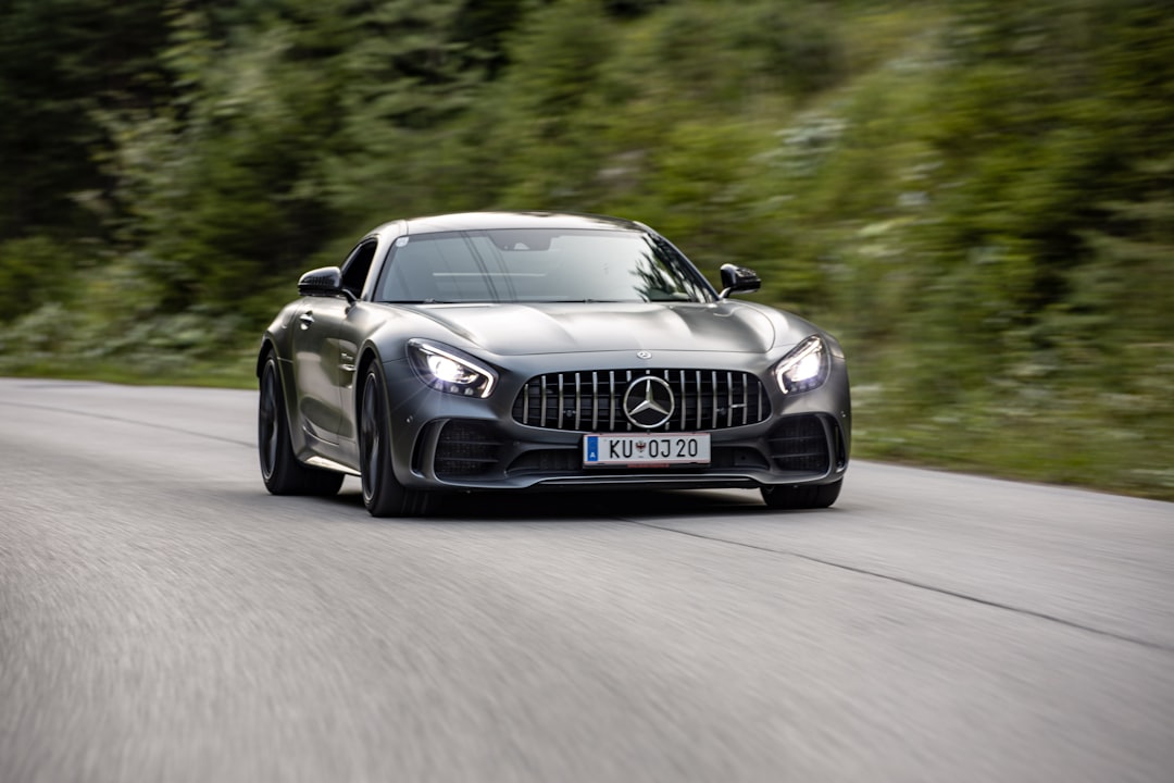 a black sports car on a road, Mercedes AMG GT-R