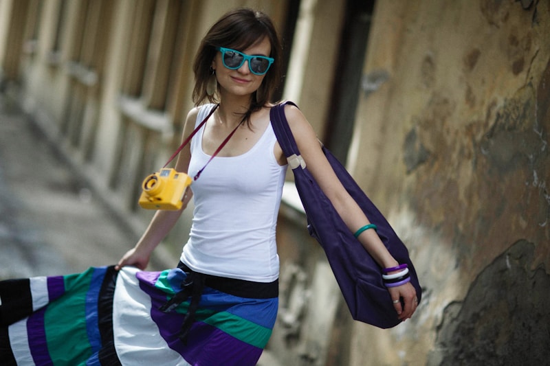 a woman wearing sunglasses and a backpack