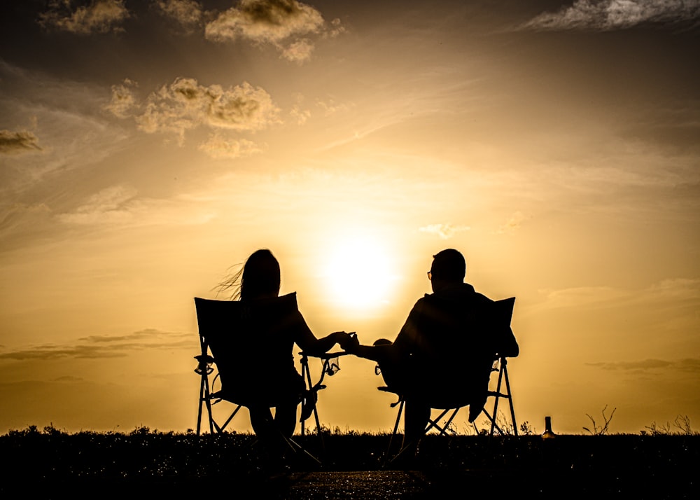 a couple sitting on a bench