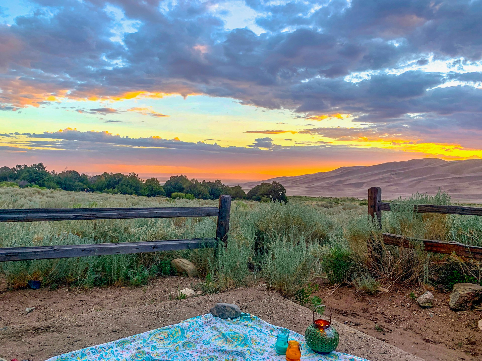 woman wearing yellow long-sleeved dress under white clouds and blue sky during daytime
