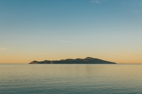 a body of water with land in the distance