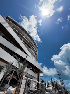 Photo of a modern construction site in the Cayman Islands with workers collaborating under a bright blue sky.