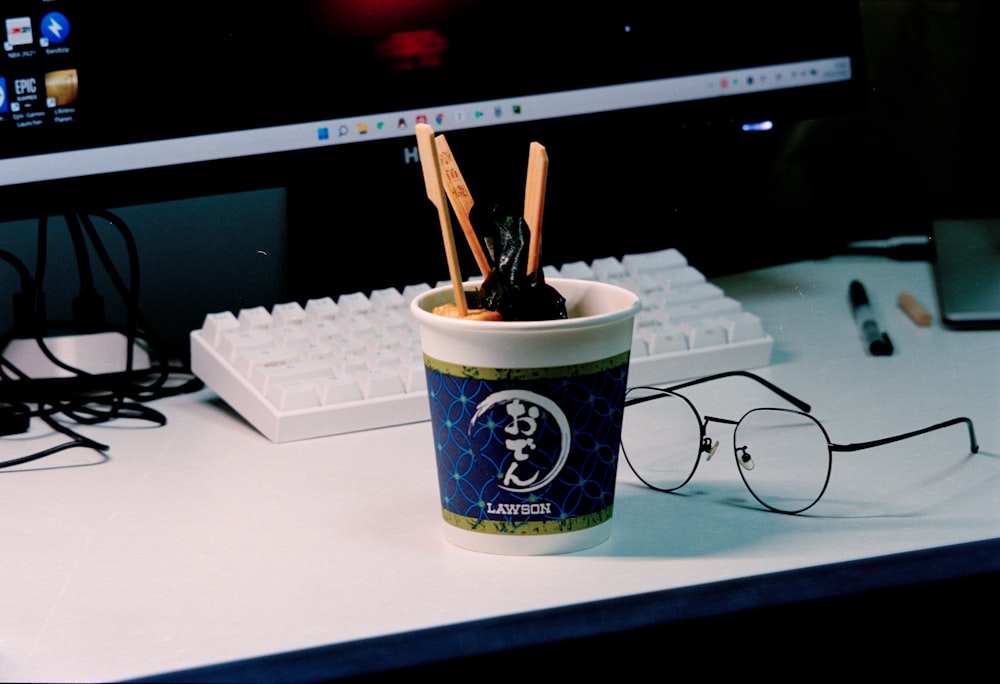 a coffee cup with a straw