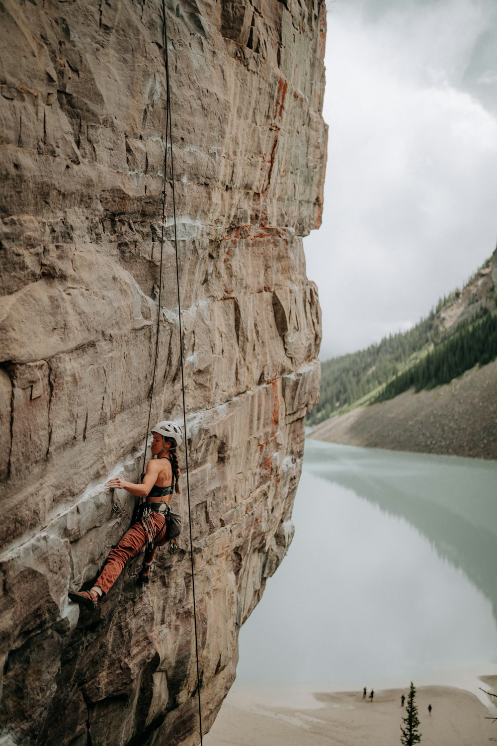 a man climbing a rock wall