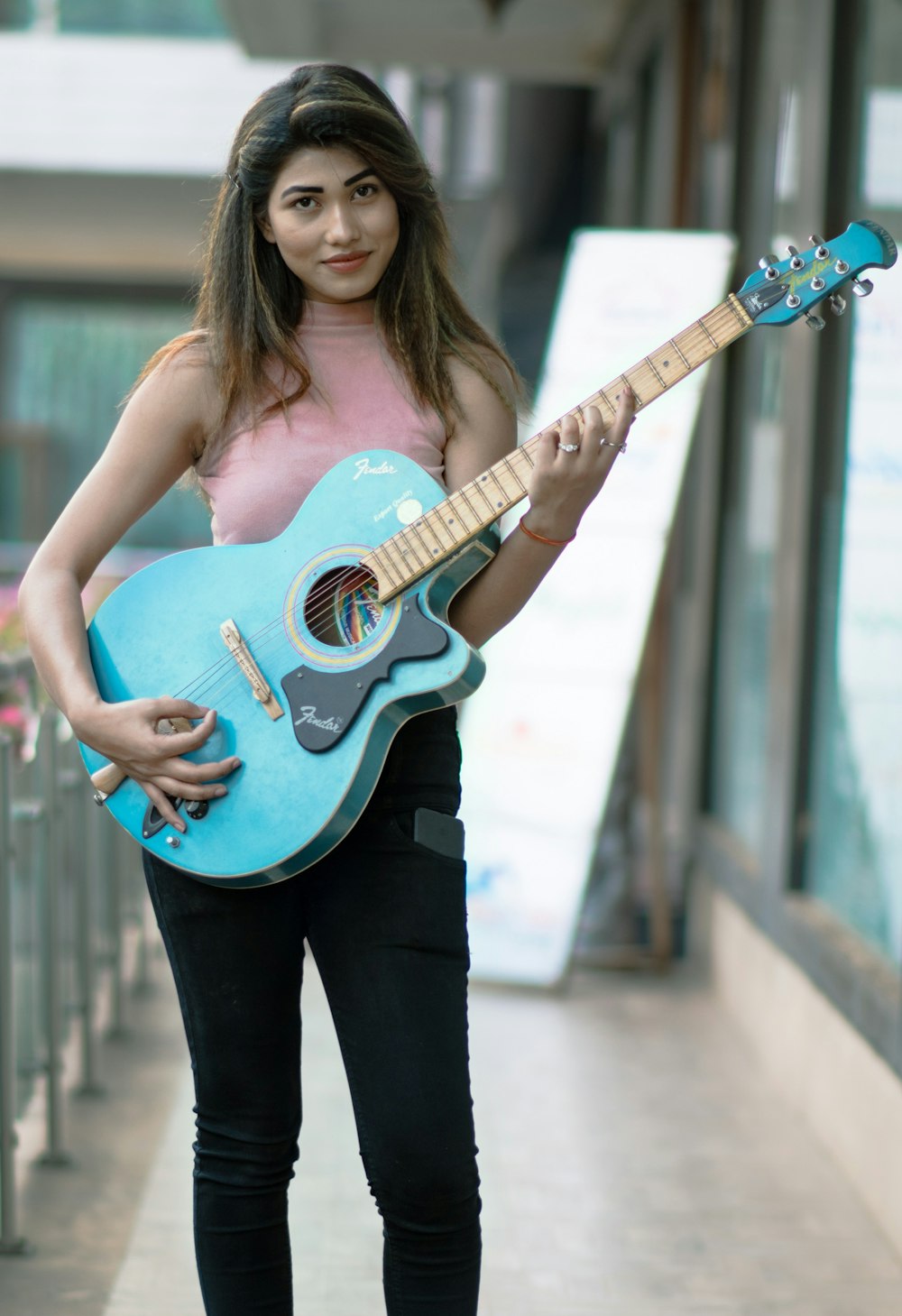 a woman holding a guitar