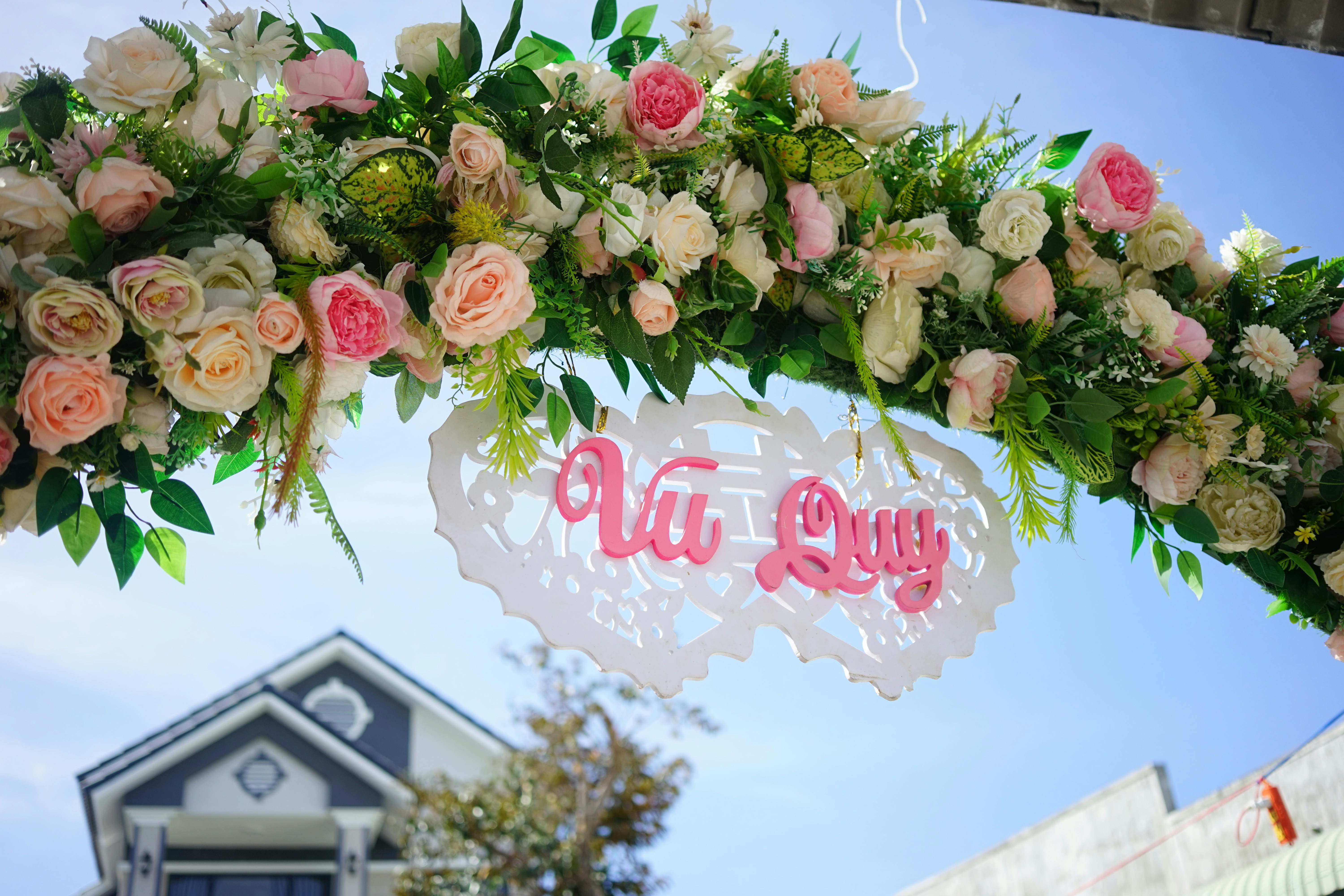 a sign with flowers on it