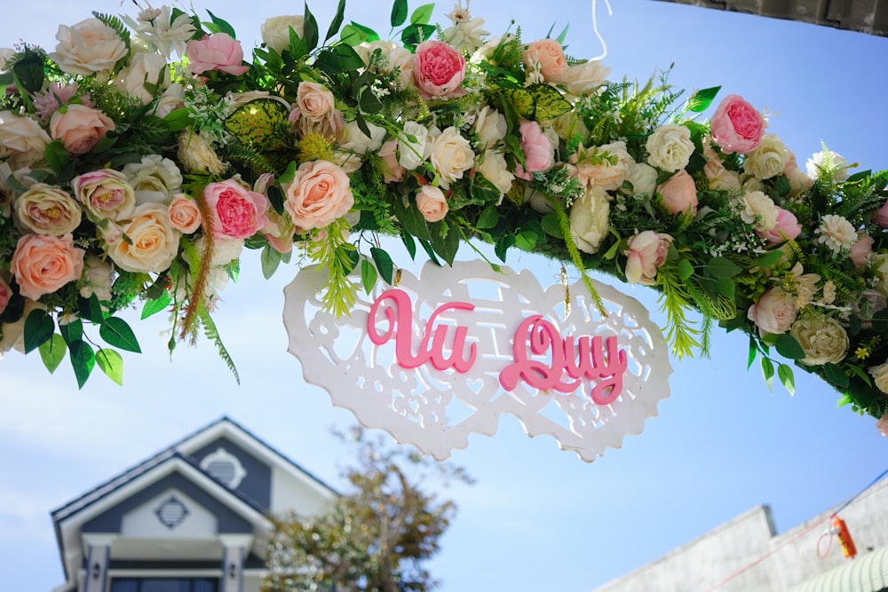 a sign with flowers on it