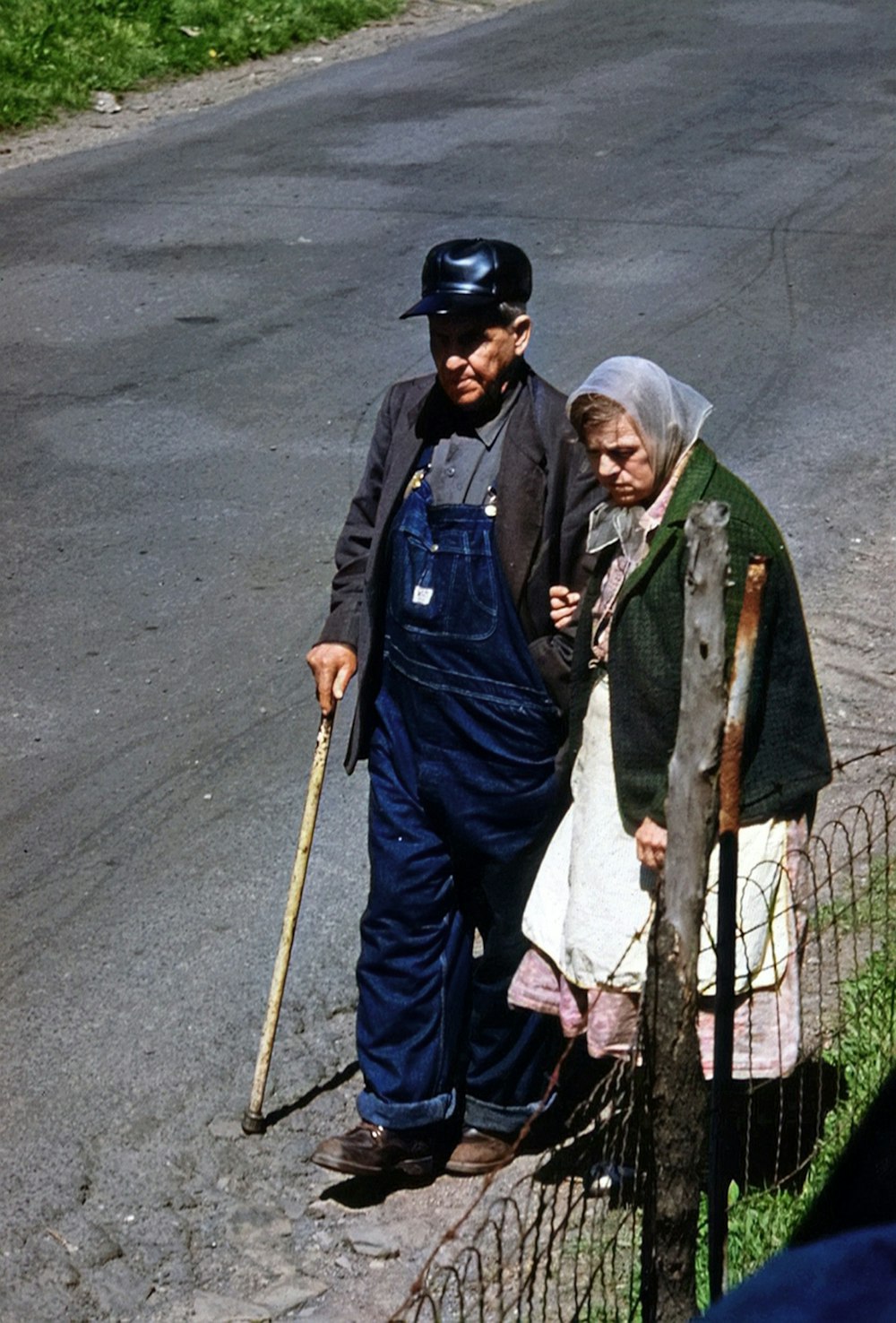 a man and woman holding a fishing pole