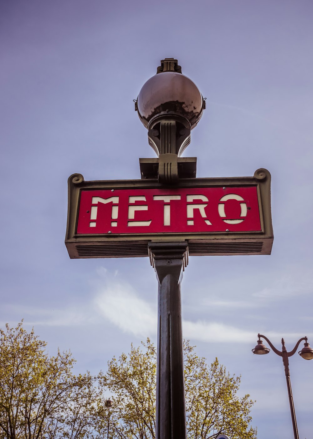 a sign with a globe on top