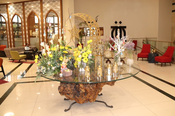 Chic glass side table with decorative elements.
