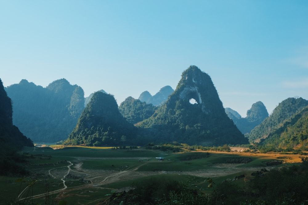 a landscape with mountains in the back with Li River in the background