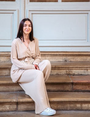 a person sitting on stairs