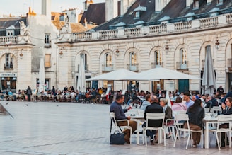 people sitting at tables outside