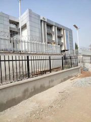 A government facility exterior with subtle security features and neutral tones.