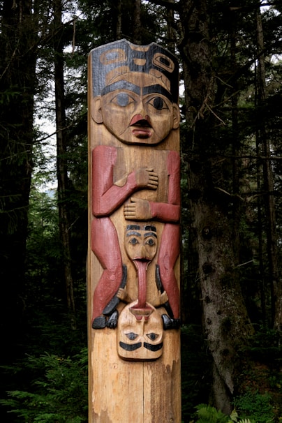 a wood carving of a person with a mustache and a beard