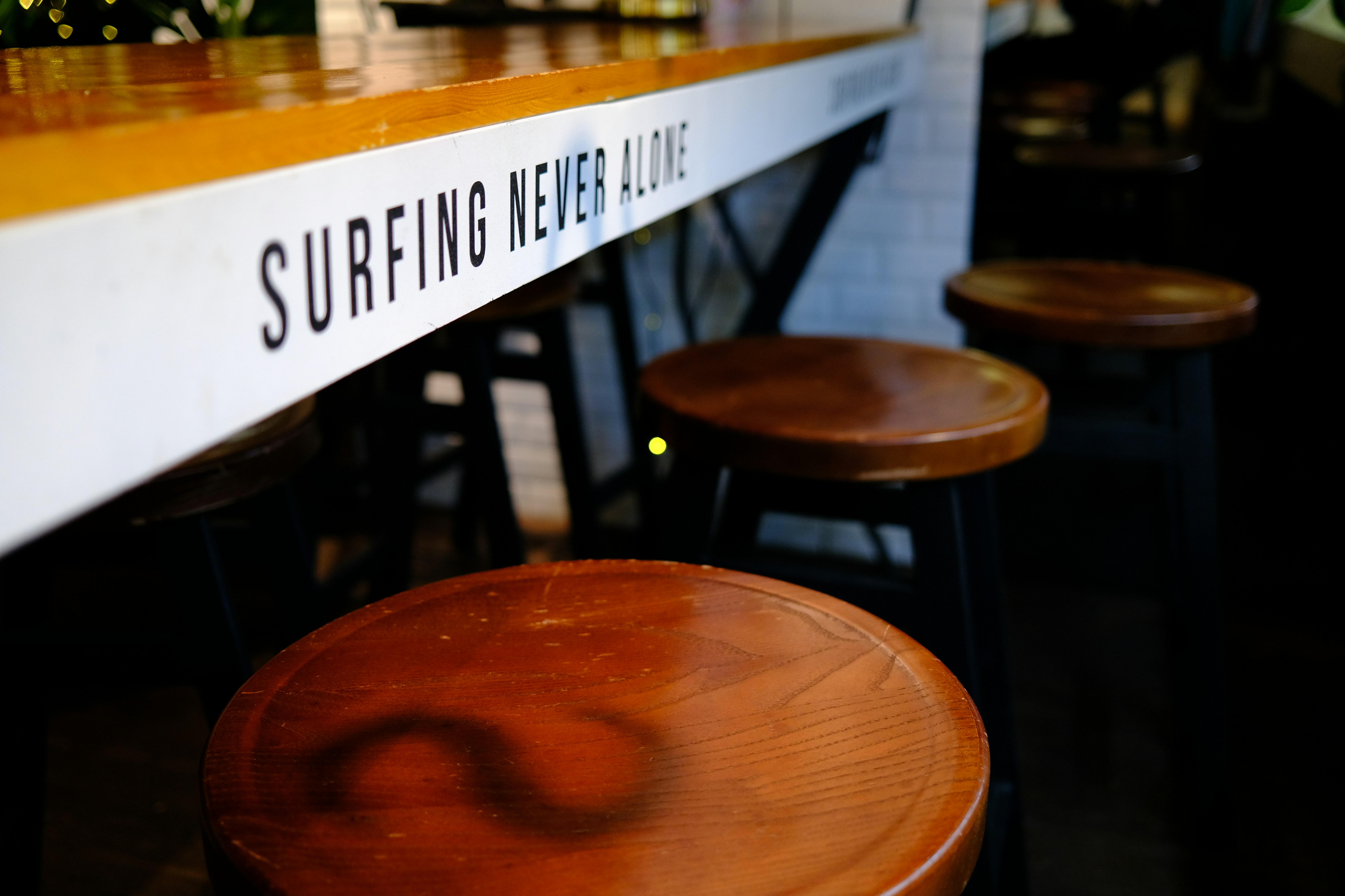 a group of stools in a bar