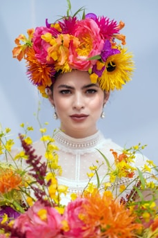 Wearable floral art like flower crowns and boutonnieres for celebrations.