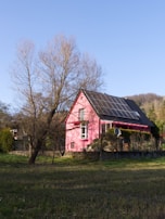 a red barn with a black roof