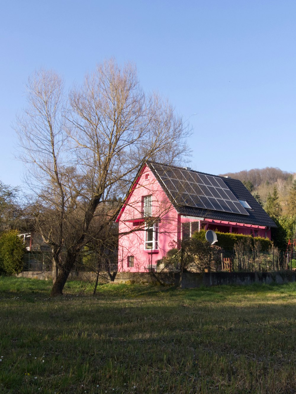 a red barn with a black roof