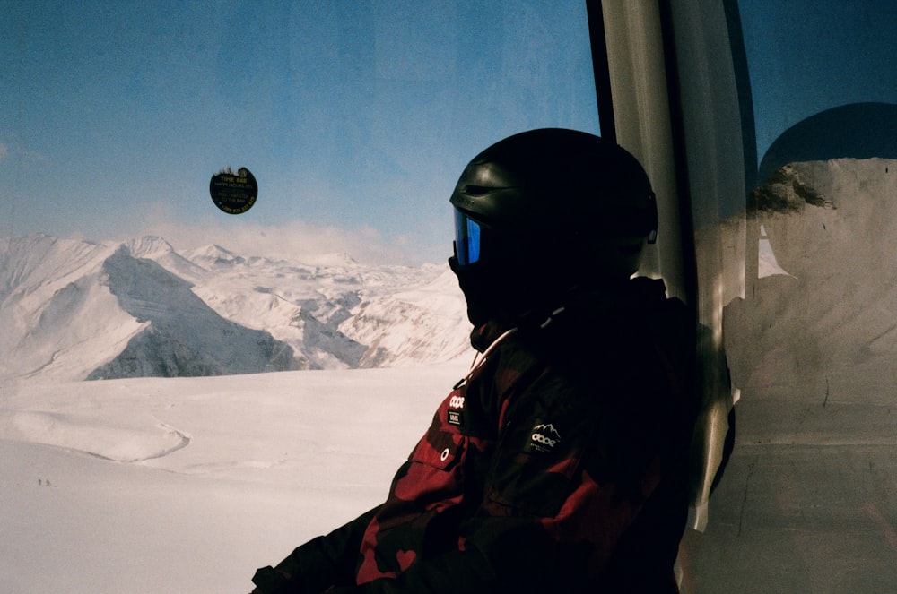 a person in a helmet in a snowy environment