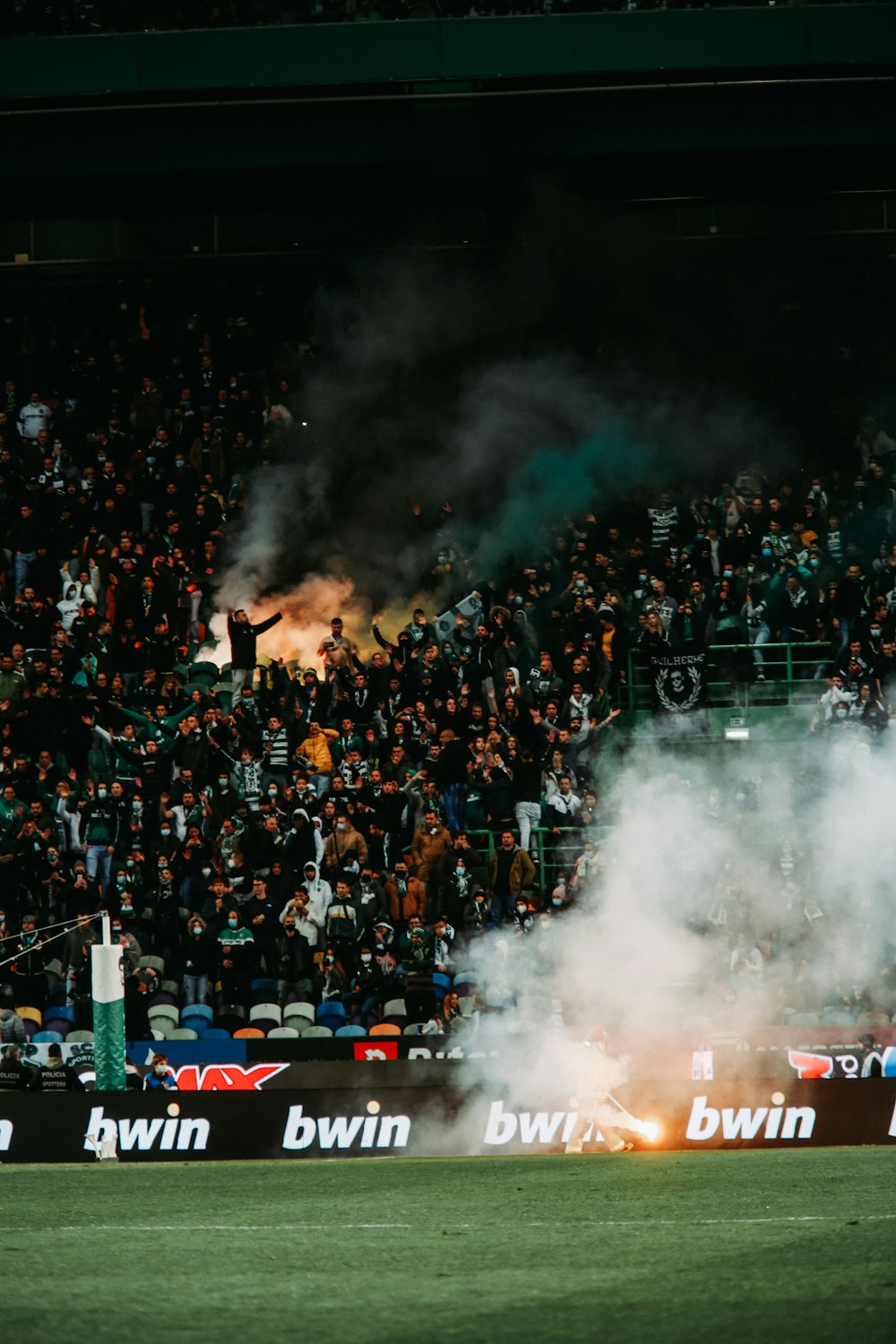 a large crowd of people watching a match