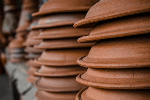 Close-up of a textured terracotta pot with subtle earthy tones.