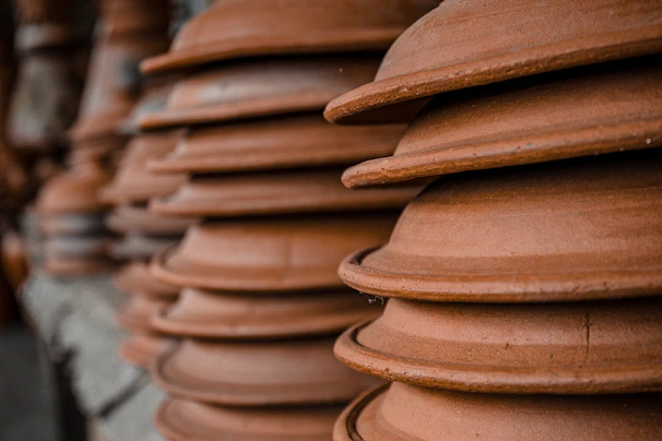 Artistic close-up of textured terracotta pottery, reflecting the center’s earthy and warm aesthetic.