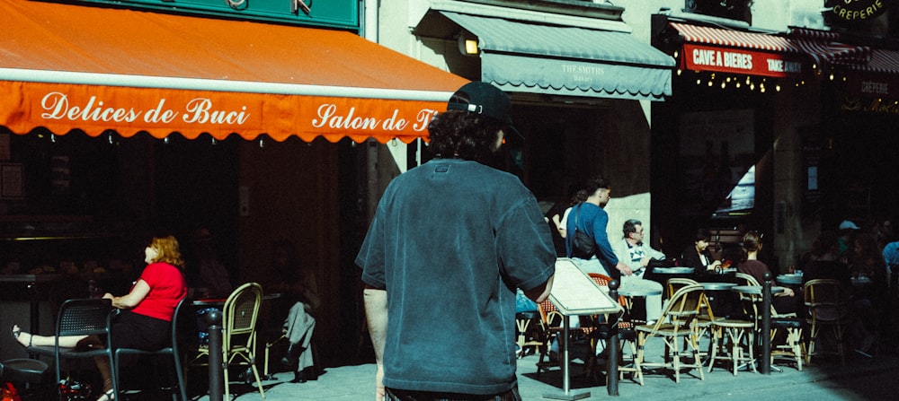 a person standing in front of a restaurant