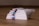 A close-up of soft facial tissues stacked neatly on a table.