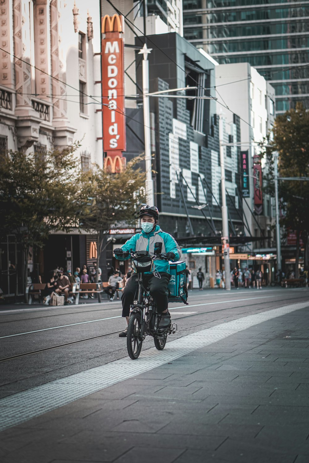 a person riding a bicycle on a street