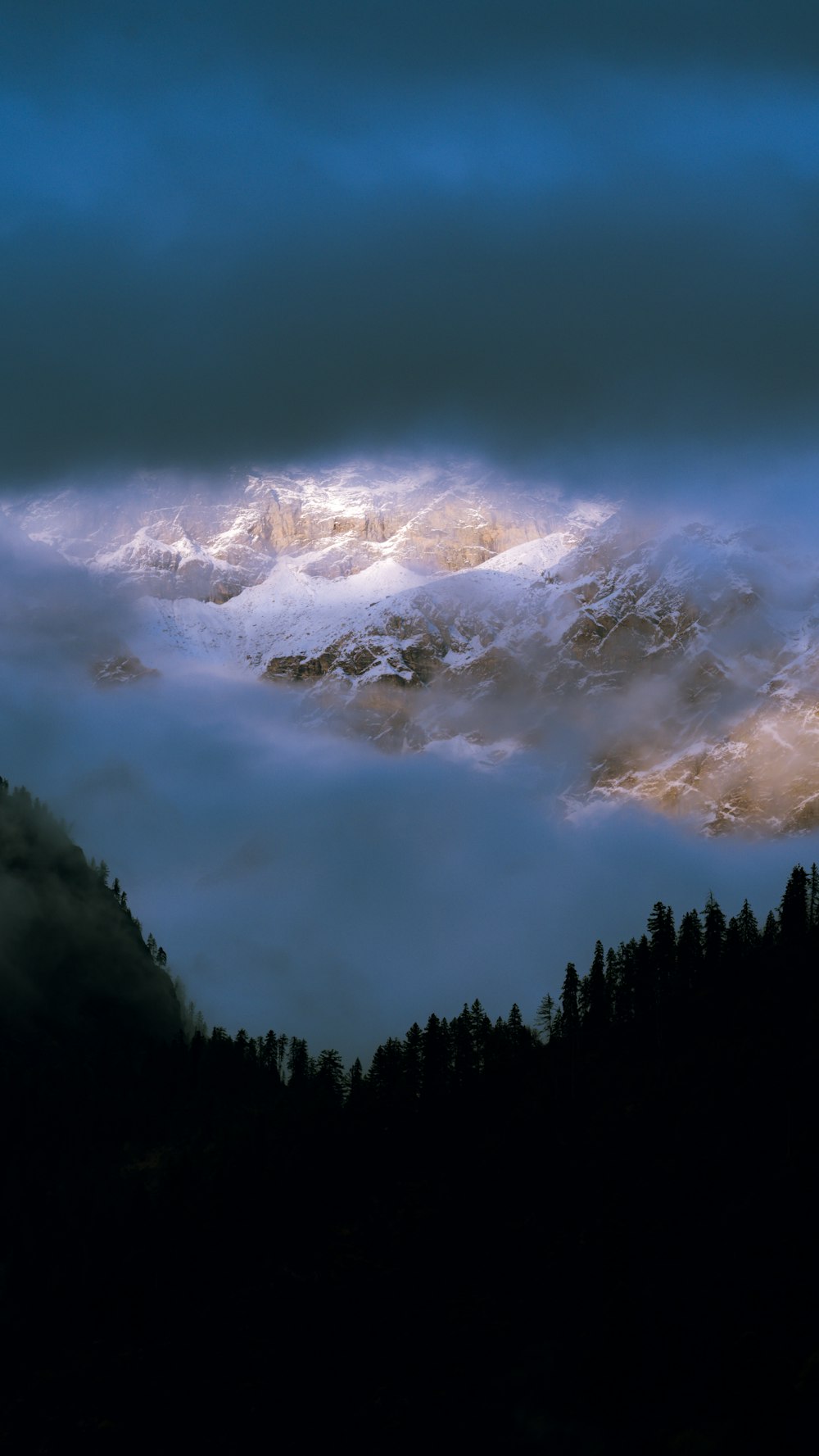 a mountain with clouds