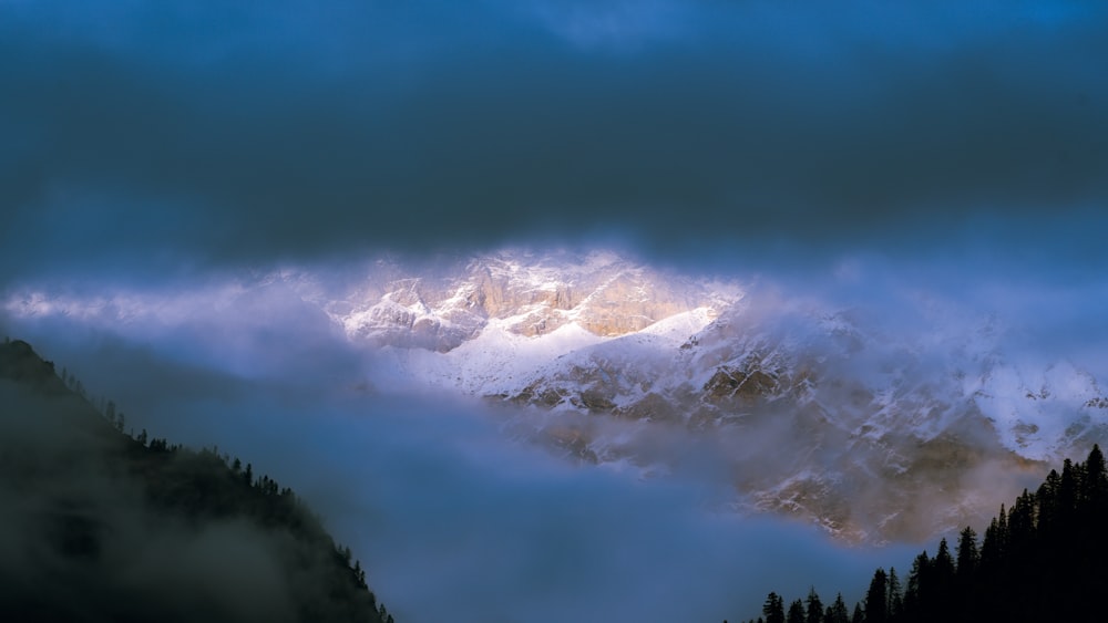 a mountain with clouds