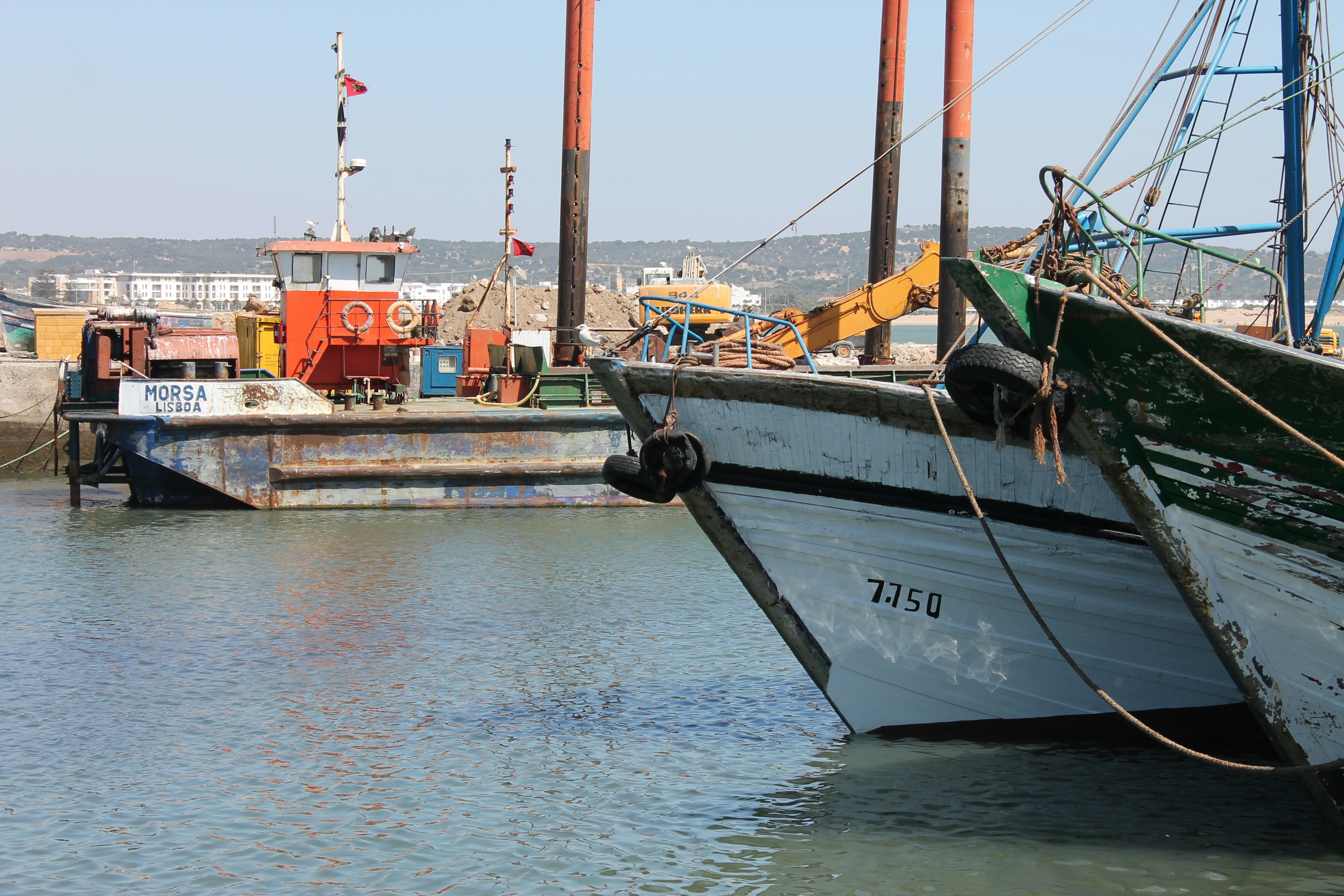 Boat securely moored near a custom-built dock by Pearce Marine Construction - shore anchor for boat