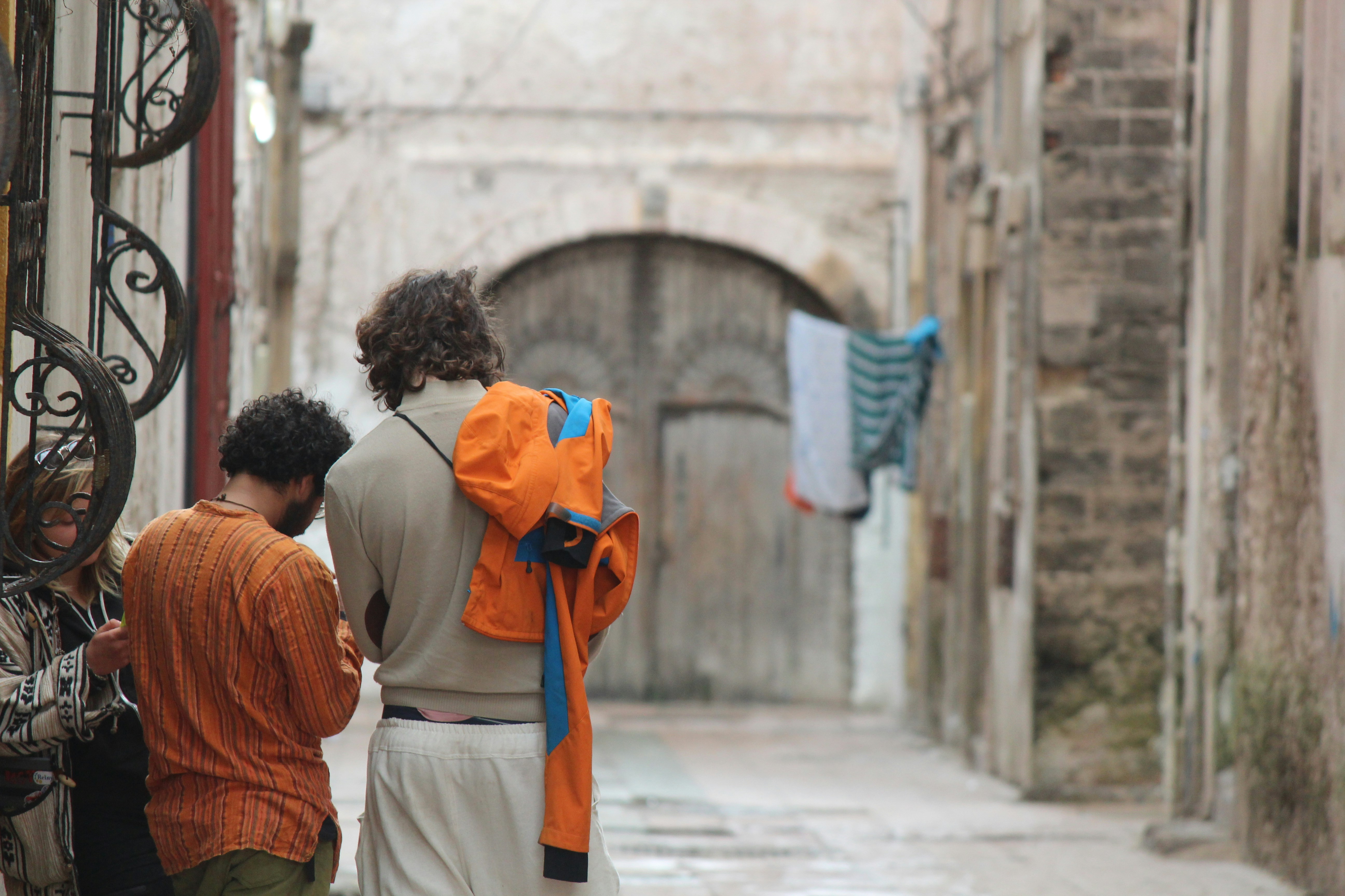 a group of people walking down a street