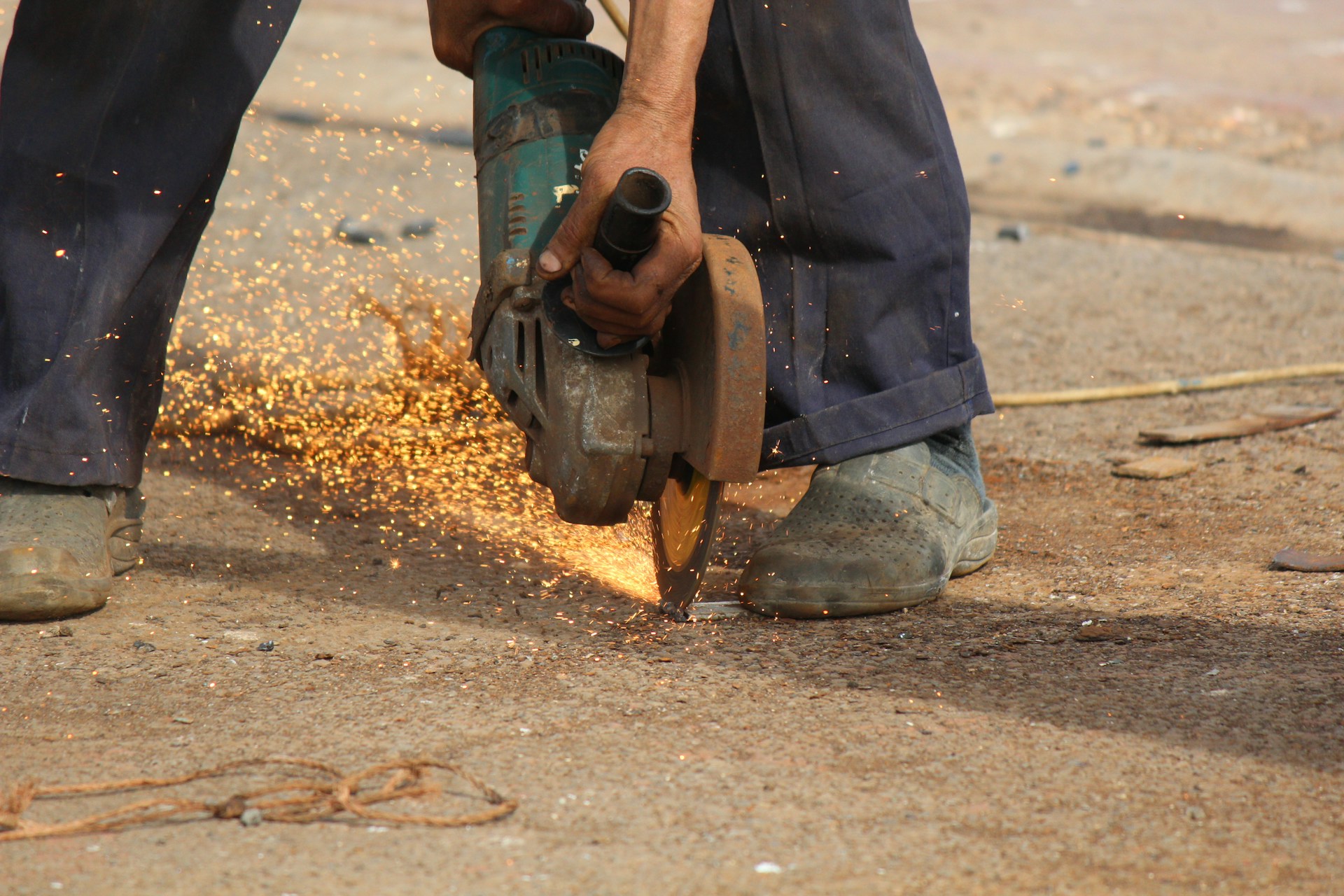 a person pouring water into a pipe