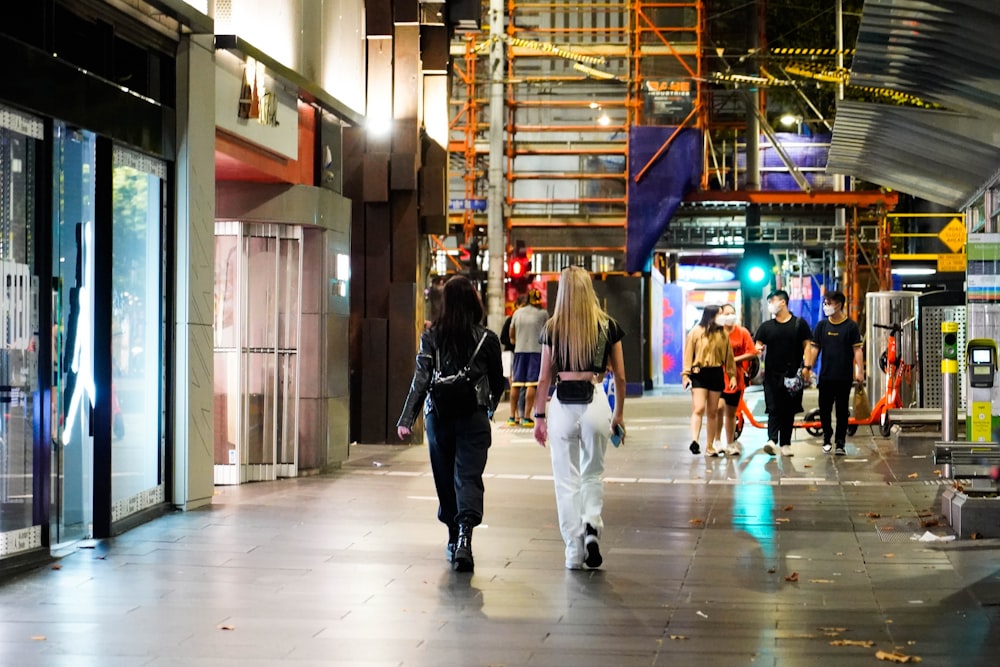 people walking in a large building