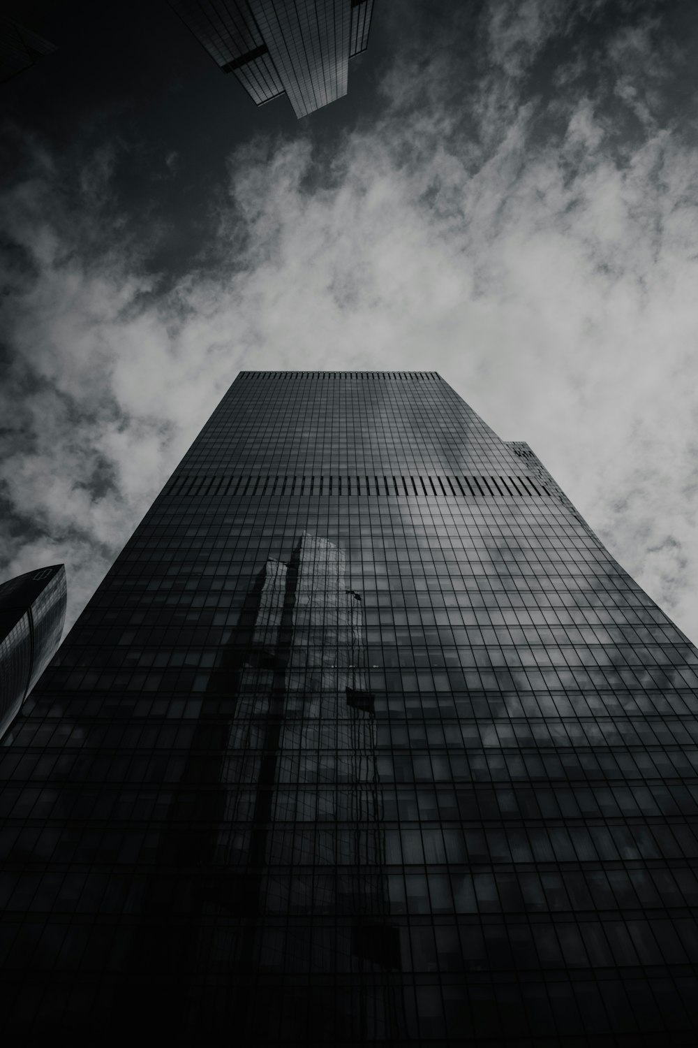 a tall building with a cloudy sky