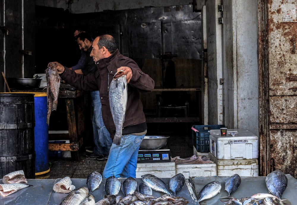 a person holding a fish