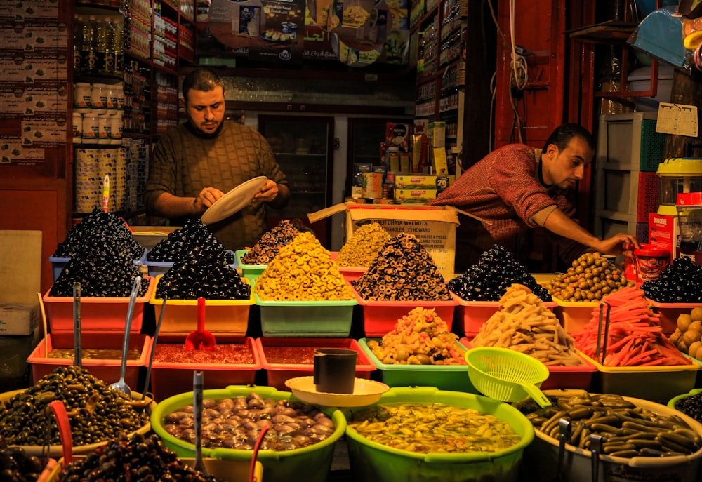 a couple of men in a market