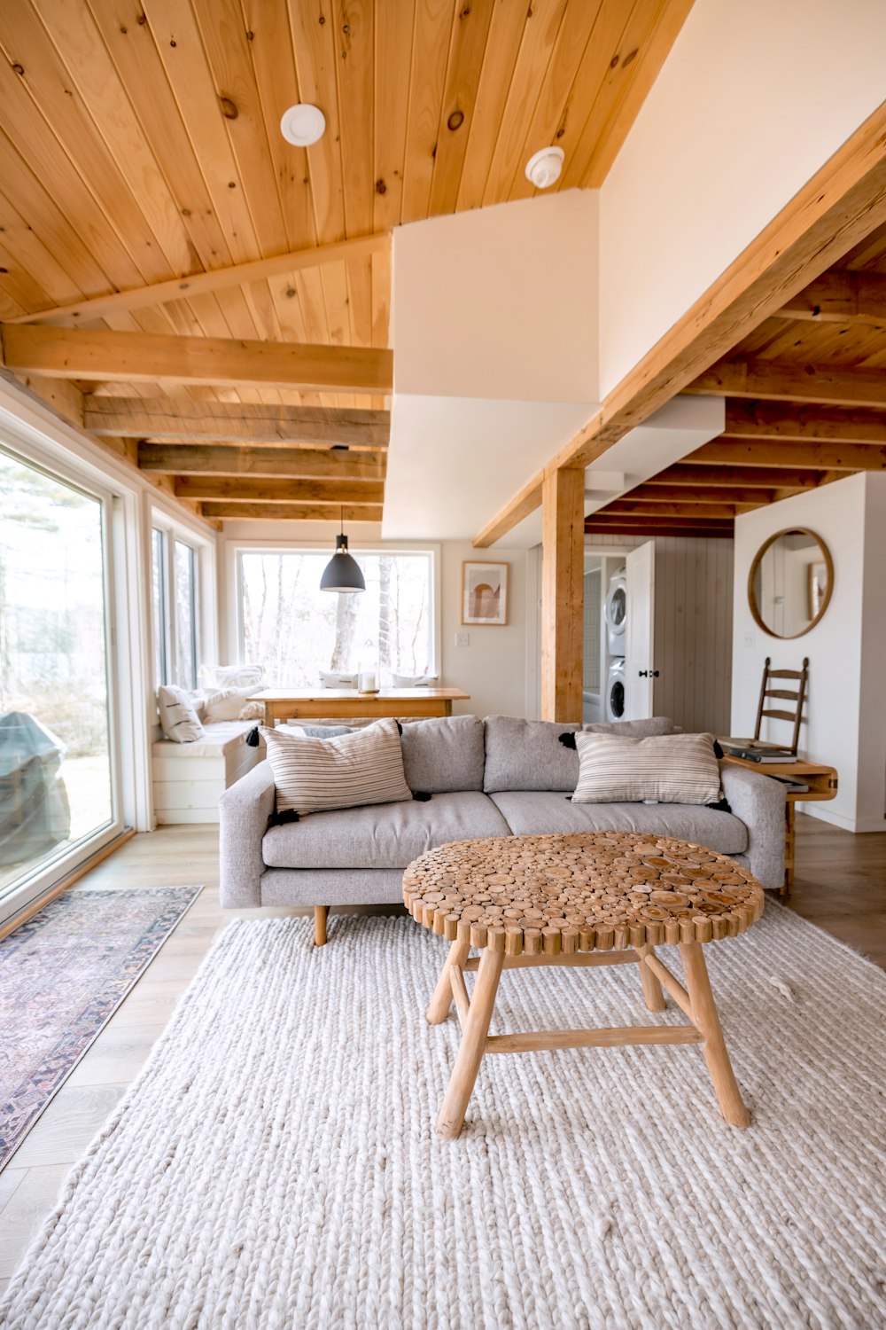 a living room with a wood ceiling