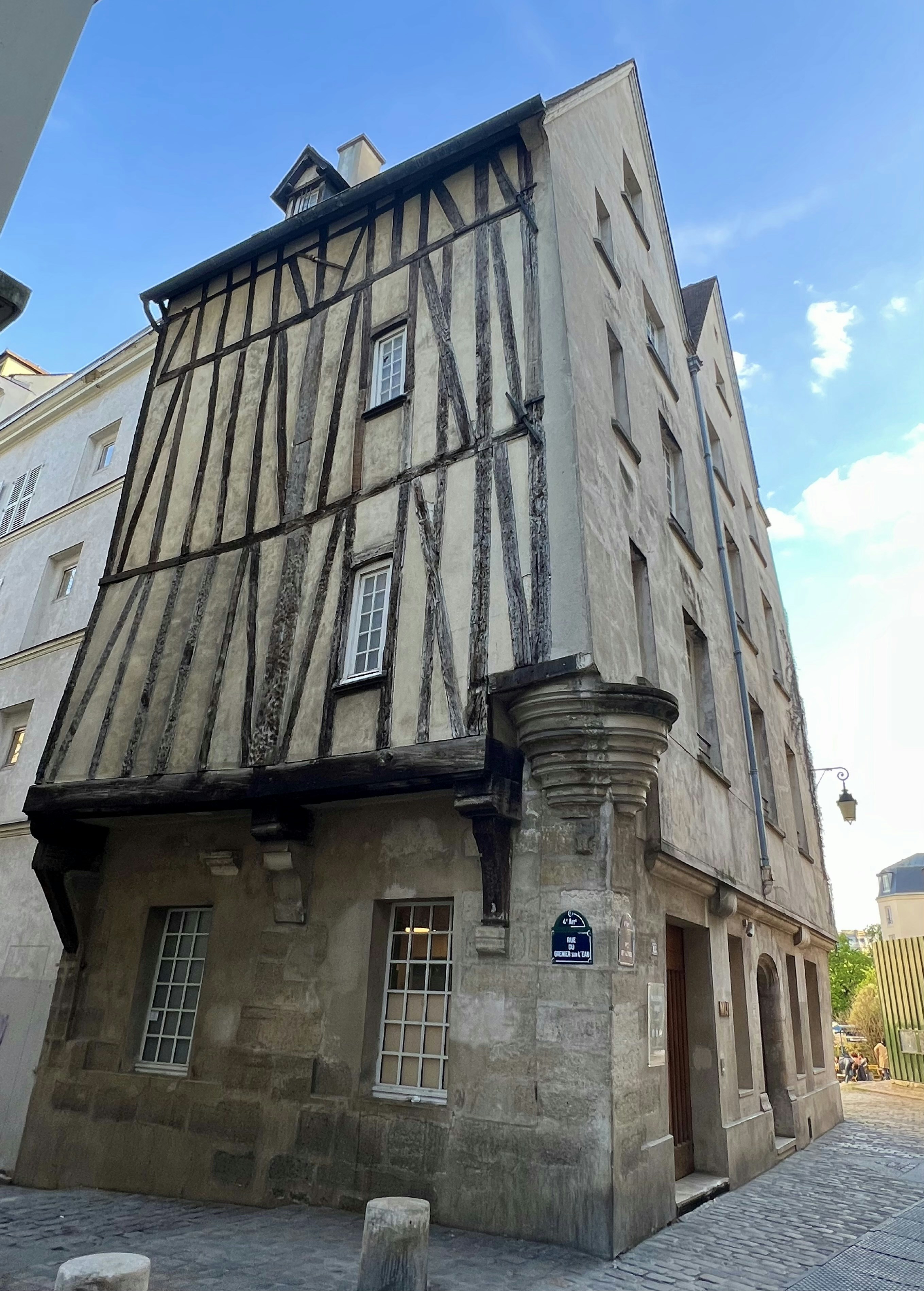 a stone building with a sign on it