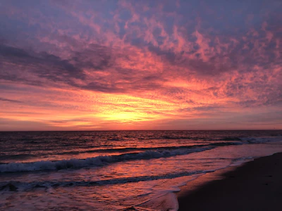 A vibrant sunset over a peaceful beach.